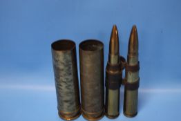 A PAIR OF WWII SHELL CASES AND BULLETS, one stamped 551 CY 79 PRAC 4* Z, the other 70 CY 80 PRAC 4 *