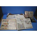 A COLLECTION OF BRITISH AND WORLD STAMPS, loose and in albums, along with a box of assorted covers