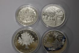 FOUR SILVER CROWN SIZED COINS