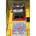 A VINTAGE 'NOVIMPRIM' CHILD'S PRINTING PRESS, in original box with instruction leaflet