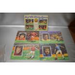 GEORGE BEST, BOBBY MOORE, GORDON BANKS, ALAN BALL "A SET OF FOUR EXCITING JIGSAWS", each jigsaw 8" x