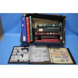 A COLLECTION OF BRITISH AND WORLD STAMPS presented in stock books to include definitives