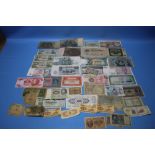 A QUANTITY OF WORLD BANKNOTES to include Chinese, Military interest, German types etc.