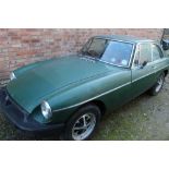 A 1979 BRITISH RACING GREEN MG SPORTS CAR, 1.8L PETROL 'COX 221V', KEYS, MOT TIL 11TH DEC 2021,