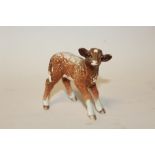 A BESWICK DAIRY SHORTHORN CALF FIGURE, facing right