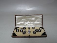 A CASED SET OF ART DECO DESIGN SILVER AND ENAMEL CUFFLINKS AND COLLAR STUDS ETC.