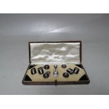 A CASED SET OF ART DECO DESIGN SILVER AND ENAMEL CUFFLINKS AND COLLAR STUDS ETC.