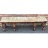 AN ANTIQUE CARVED OAK AND UPHOLSTERED WINDOW SEAT / BENCH, W 142 cm, D 29 cm, H 42 cmCondition