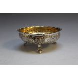 A HALLMARKED SILVER GILDED BOWL BY HENRY HOLLAND - LONDON 1877, on three lion mask style feet,