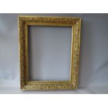 A 19TH CENTURY DECORATIVE GOLD FRAME, frame W 8 cm, rebate 56.5 x 44 cm