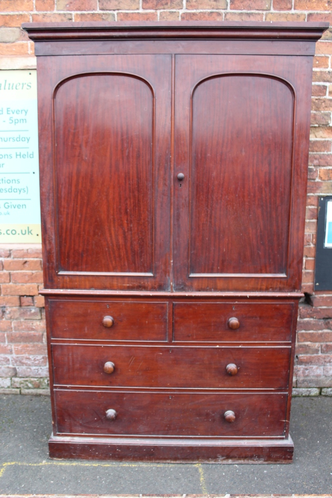 A GEORGIAN MAHOGANY LINEN PRESS, the twin door upper section opening to a space for shelves (No