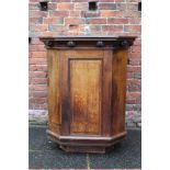 AN OAK PULPIT, with three panelled sides and one open side (door missing), with seven carved roses