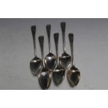 A MATCHED SET OF SIX HALLMARKED SILVER DESSERT SPOONS WITH CREST OF A BIRD PERCHED ON A BUGLE,
