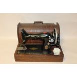 A CASED SINGER SEWING MACHINE - F8339599