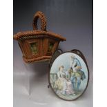 AN UNUSUAL FOLK ART STYLE PLAITED STRAW WORK BASKET, with double hinged covers, inset with prints of
