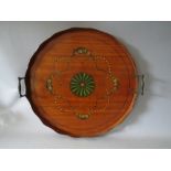 AN EDWARDIAN SATINWOOD PAINTED TRAY, of circular outline with twin brass carry handles, decorated