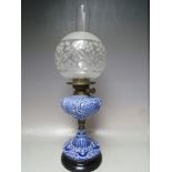 A VICTORIAN BLUE CERAMIC OIL LAMP, with twin Duplex burner, decorative glass shade and clear