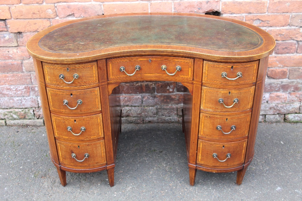 AN EDWARDIAN MAHOGANY AND INLAID KIDNEY SHAPED DESK, with inset green tooled leather writing