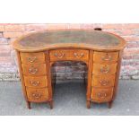 AN EDWARDIAN MAHOGANY AND INLAID KIDNEY SHAPED DESK, with inset green tooled leather writing