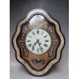 A FRENCH VINEYARD CLOCK, with ovoid case, mother of pearl inlays and glass dial striking on a coiled