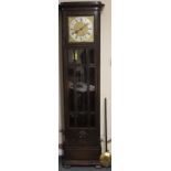 AN EARLY TWENTIETH CENTURY OAK GLAZED LONGCASE CLOCK, with triple weight, the gilt and silvered dial