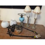 A CAST METAL HANGING OIL LAMP, overall H 81 cm, together with a table oil lamp with blue ceramic