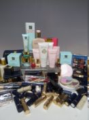 A LARGE COLLECTION OF MAKE UP AND SKIN CARE ITEMS, to include face creams, body lotion, eye