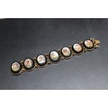 A LATE 19TH / EARLY 20TH CENTURY GRAND TOUR STYLE MICRO MOSAIC PANEL LINK BRACELET, the individual