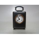 A FINE MINIATURE FRENCH TRAVEL CLOCK, housed in a polished steel case with carry handle, convex