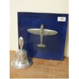 AN RAF BENEVOLENT FUND HAND BELL, together with a pewter model aircraft in blue / clear lucite block
