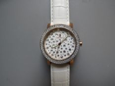 A MODERN DESIGNER CAPRI WATCH BY SILVIO STAIANO, the circular white face set with multiple Swarovski