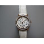 A MODERN DESIGNER CAPRI WATCH BY SILVIO STAIANO, the circular white face set with multiple Swarovski