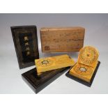 A BOXED CHINESE WOODEN COMPASS / SUNDIAL SET, the outer wooden box containing two lacquerware