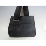 A VINTAGE BLACK SUEDE LEATHER LADIES HANDBAG, unusual styling with single panel strap and leather