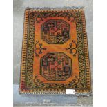 AN EASTERN WOODEN RUG / KILIM, mainly on a red / brown ground, 85 x 67 cm