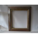 EDWARDIAN DUTCH CARVED WOODEN FRAME, with gold slip, frame W 9.5 cm, rebate 55 x 48.5 cm, slip