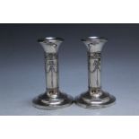 A PAIR OF HALLMARKED SILVER CANDLESTICKS - BIRMINGHAM 1905, with swag and bow decoration, filled
