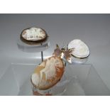 A COLLECTION OF THREE VINTAGE CARVED CAMEO BROOCHES. comprising a yellow metal framed cameo