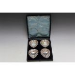 A CASED SET OF FOUR HALLMARKED SILVER PIERCED BON BON DISHES BY JAMES DEAKIN & SONS - CHESTER