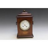 AN EDWARDIAN MAHOGANY BRACKET CLOCK, with twin carry handles, H 31.5 cm