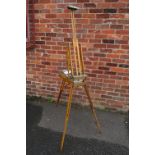 A VINTAGE PORTABLE ARTISTS EASEL, height when closed, 56 cm, width when closed 24 cm