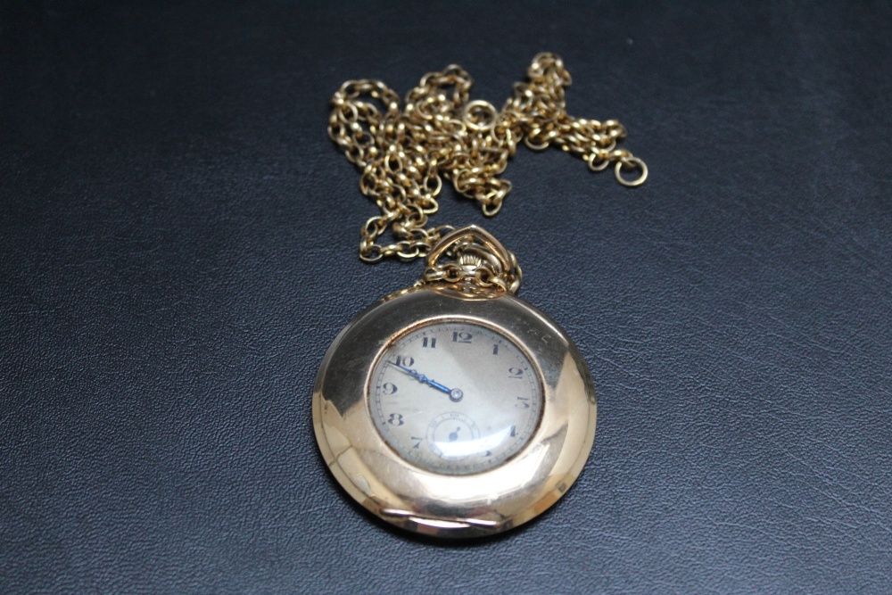 A HALLMARKED 9 CARAT GOLD OPEN FACED MANUAL WIND POCKET WATCH, on hallmarked 9 carat gold chain,
