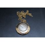 A HALLMARKED 9 CARAT GOLD OPEN FACED MANUAL WIND POCKET WATCH, on hallmarked 9 carat gold chain,