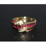 A RUBY AND DIAMOND CLUSTER RING, set in yellow metal stamped 750, approx weight 6.8g, ring size O