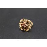 A HALLMARKED 9 CARAT GOLD GARNET CLUSTER RING, approx weight 7g, ring size L
