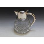 A LARGE SILVER PLATED CUT GLASS LEMONADE JUG, with integral cooling cylinder, H 26 cm