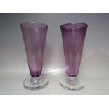 A PAIR OF KEITH MURRAY FOR STEVENS & WILLIAMS (ROYAL BRIERLEY) AMETHYST GLASS VASES, of flared