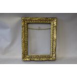 AN EIGHTEENTH / NINETEENTH CENTURY CARVED WOODEN DECORATIVE GOLD FRAME, width of frame 7 cm,