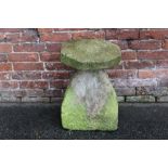 AN ANTIQUE STADDLE STONE