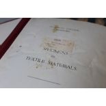 AN EARLY / MID 20TH CENTURY FOLDER OF TEXTILE MATERIAL SPECIMENS, dated 1928-29, relating to